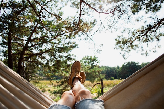 Front view man on hammock relaxing