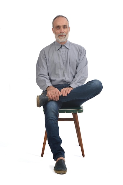 Front view of a man sitting on chair on white background