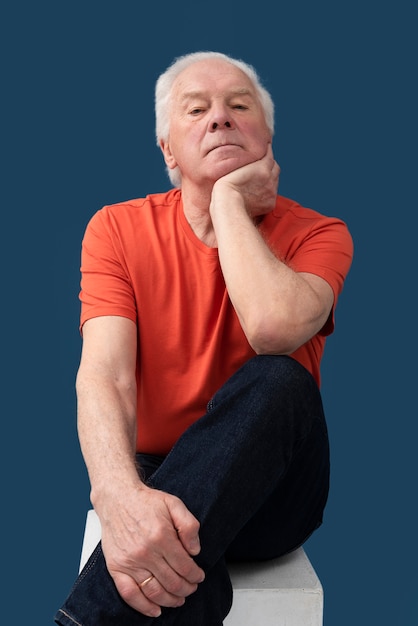 Front view man sitting on chair