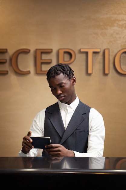 Front view man working at reception