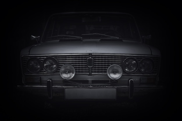 Front view of an old Russian car. Front view of radiator grill and lights