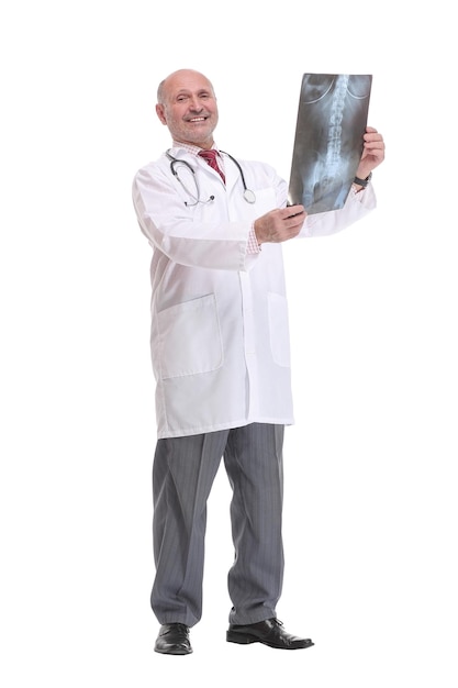 Front view of a senior doctor with stethoscope studying xray image