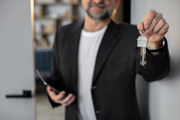 Front view smiley host holding keys