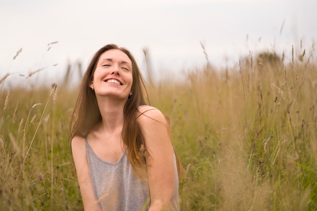 Front view smiley woman in nature