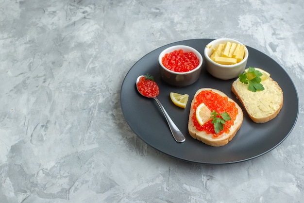 front view tasty caviar sandwiches inside plate with cheese on a white surface snack dinner fish food meal dish bread toast breakfast