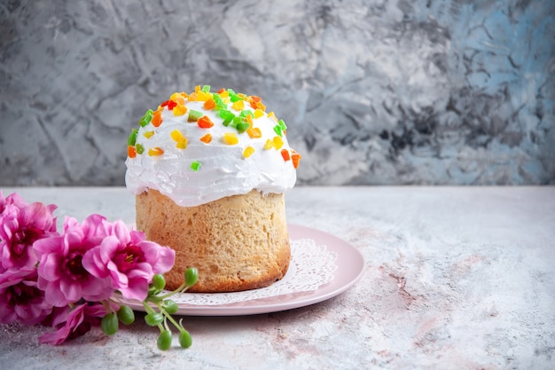 front view tasty easter cake with white cream and dried fruits inside plate on white surface spring dessert sweet pie ornate easter