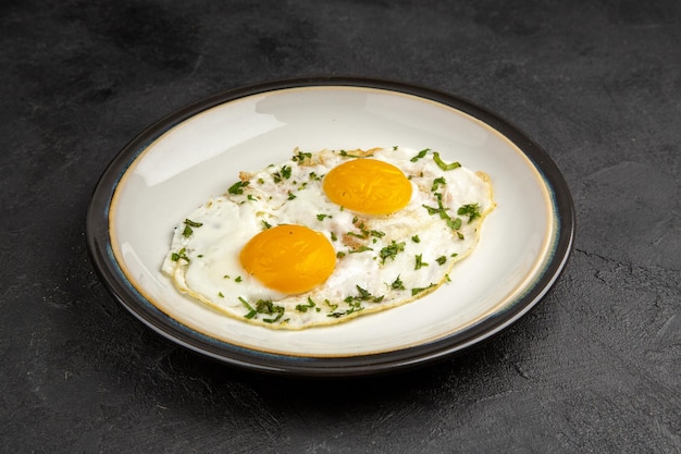 front view tasty scrambled eggs inside plate on dark background omelette food breakfast morning lunch bread tea meal