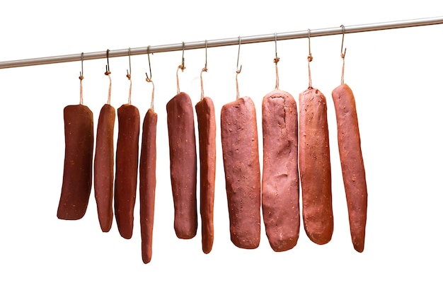 front view, Turkish meze bacon hanging on iron rod, on isolated white background. traditional food o