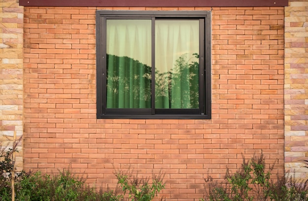 Front view of window exterior on brick wall