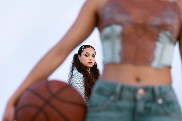 Front view woman holding ball