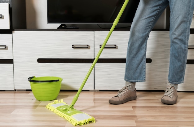 Front view of woman mopping the floor