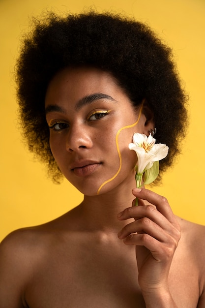 Front view woman posing with flower