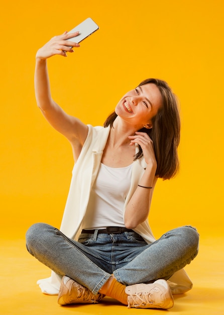 Front view of woman taking a selfie