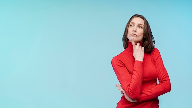 Front view of woman thinking while posing