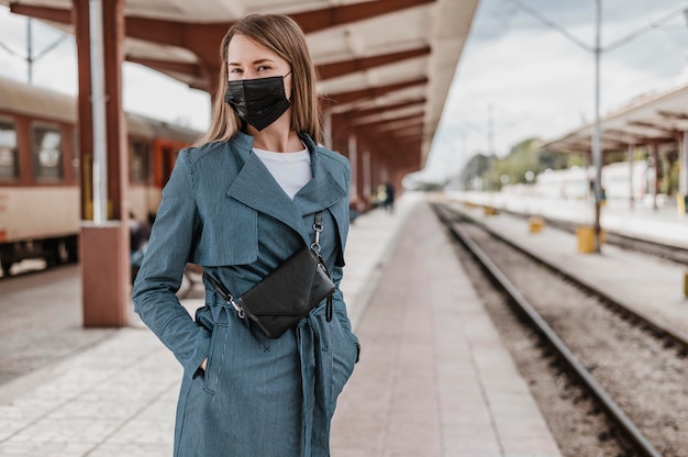 Front view woman waiting for the train