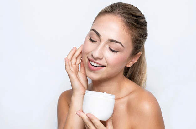 Front view of woman with beauty product concept