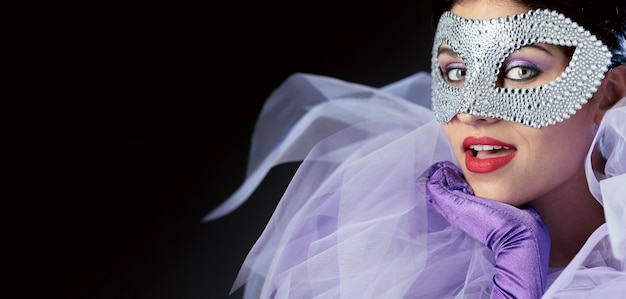 Front  view of woman with elegant carnival mask