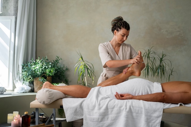 Front view woman working at a spa