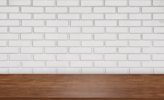 front view wooden table on brick wall background