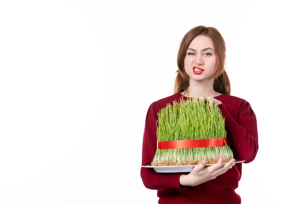 front view young female holding big novruz semeni on white background concept ethnicity family spring performer colours ethnic