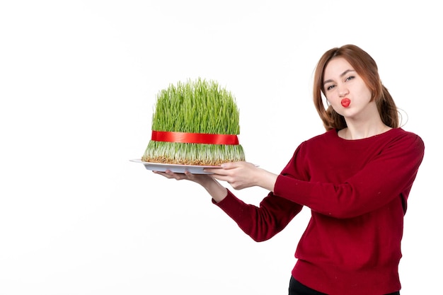 front view young female holding big novruz semeni on white background ethnicity performer colours spring holiday ethnic concept