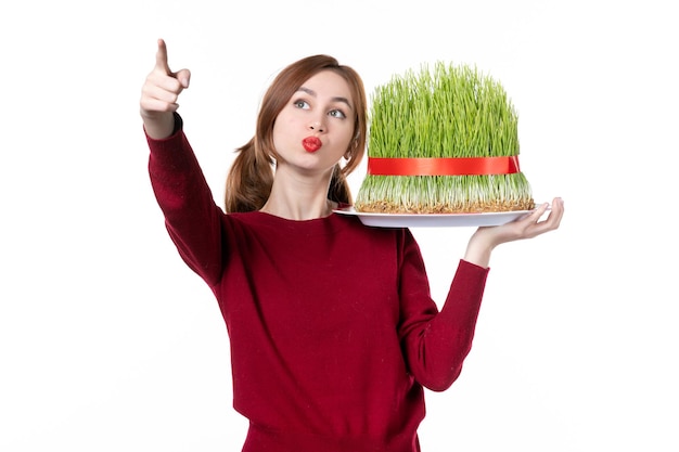 front view young female holding big novruz semeni on white background family spring ethnic performer ethnicity concept holiday