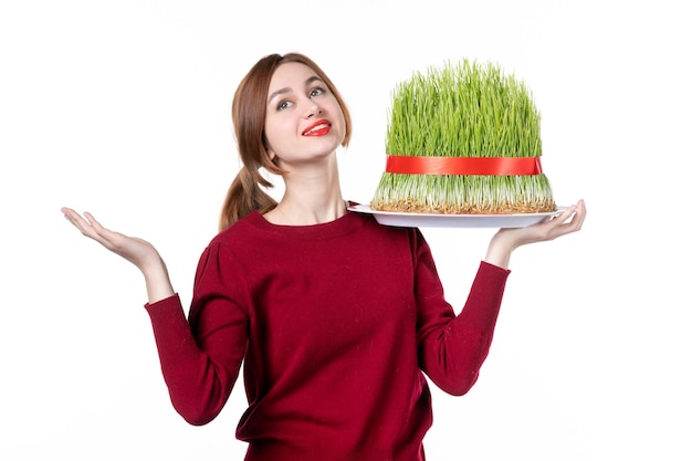 front view young female holding big novruz semeni on white background family spring performer colours ethnicity concept holiday