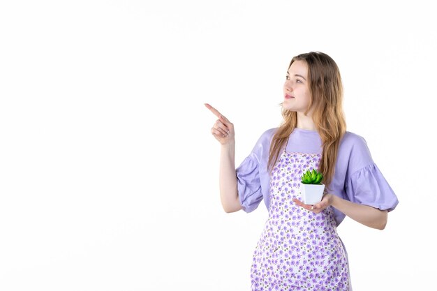 Photo front view young female holding little green plant on white background leaf plant woman green job flowers garden grass houseplant