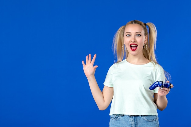 front view young female with gamepad on blue background adult joyful virtual player internet video online youth sofa