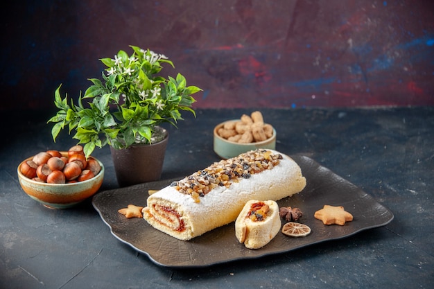 front view yummy biscuit roll with nuts on dark background pie cookie cake dessert sweet tea sugar biscuit dough