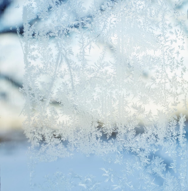 Photo frost on blue glass window background