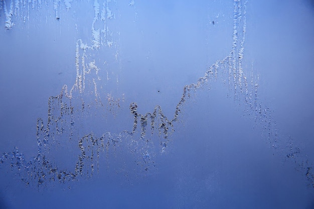 frost patterns on window glass, abstract background winter rime snow