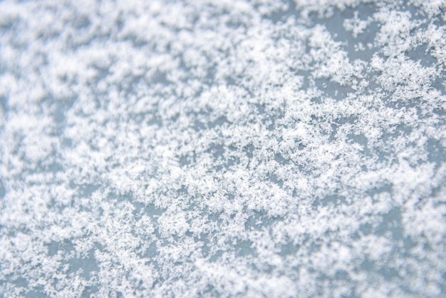 Photo frosted backgroundabstract frosty pattern on glasswinter snow backgroundfrosty patterns on the glass with empty space for text