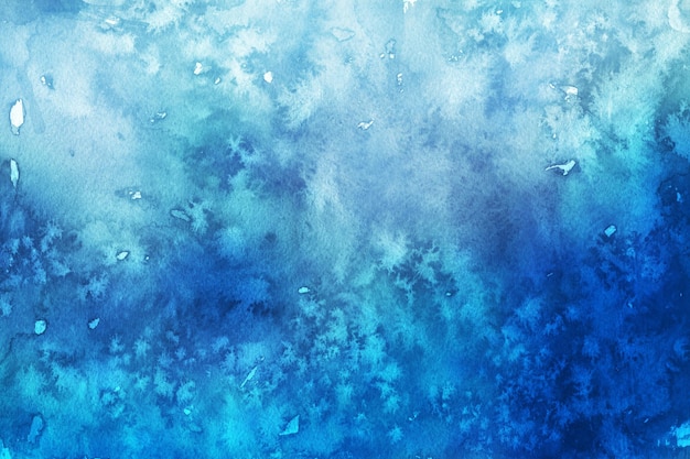 Frosted winter blue watercolor background painted on white paper