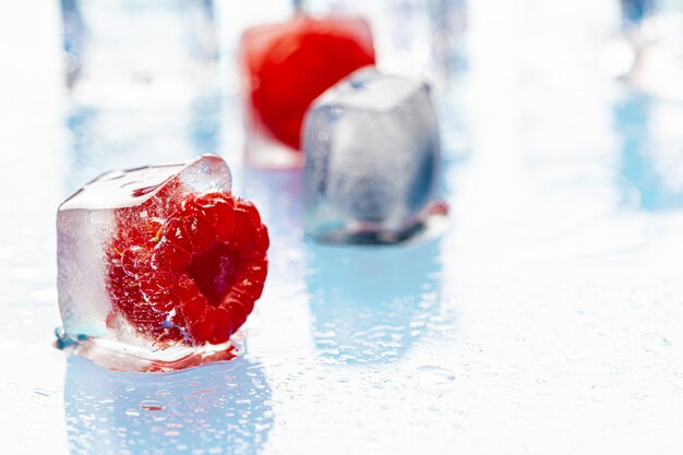 Frozen berries in ice cubes