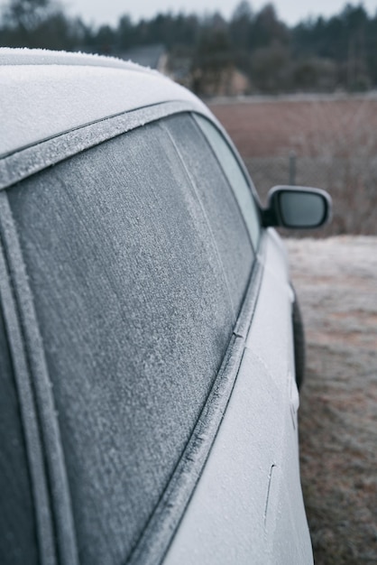 Frozen car at parking lot Frost on car windows frosted glass Frost on side car window