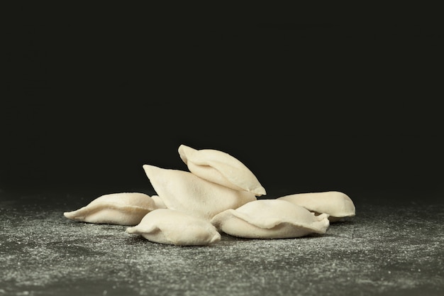 Frozen dumplings on a black background