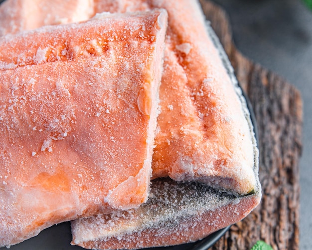 Frozen fish fillet salmon or char fresh portion dietary healthy meal food diet still life snack