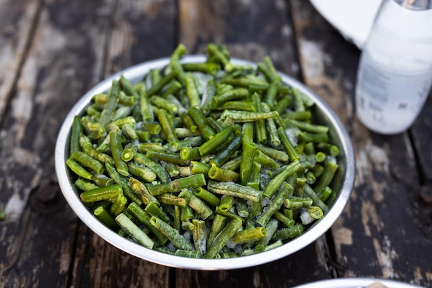 frozen green beans in a metal bowl