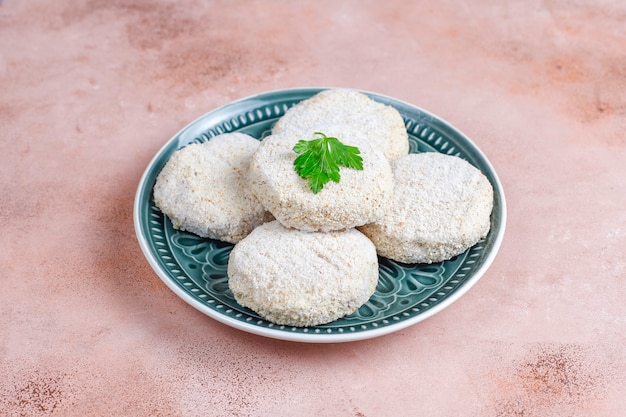 Frozen homemade round cutlets.