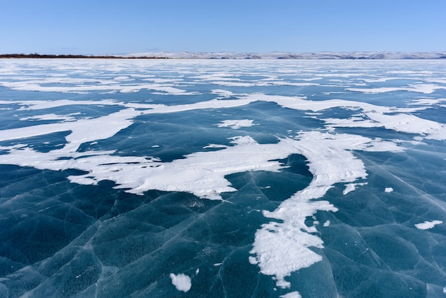 Frozen Lake Baikal. Beautiful stratus clouds over the ice surface on a frosty day.