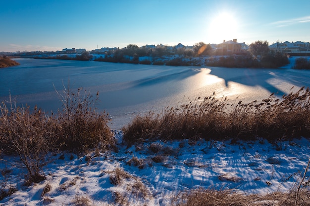 Frozen lake at winter. Early morning light.