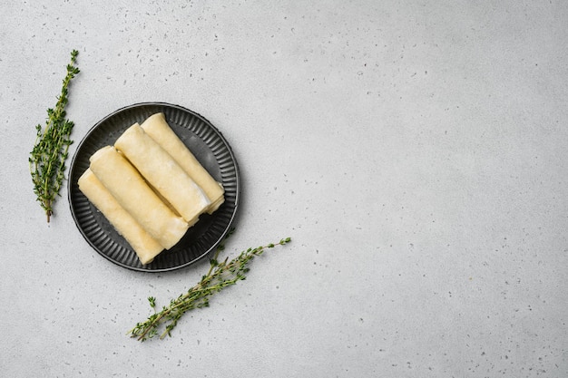 Frozen pancakes with meat on gray stone table background top view flat lay with copy space for text