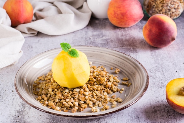 Frozen peach filled with yogurt on granola on a plate on the table Korean trendy Greek momo