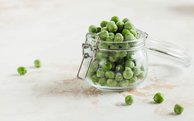 Frozen peas in a glass jar freezing is a safe method of increasing the shelf life of nutritious food...