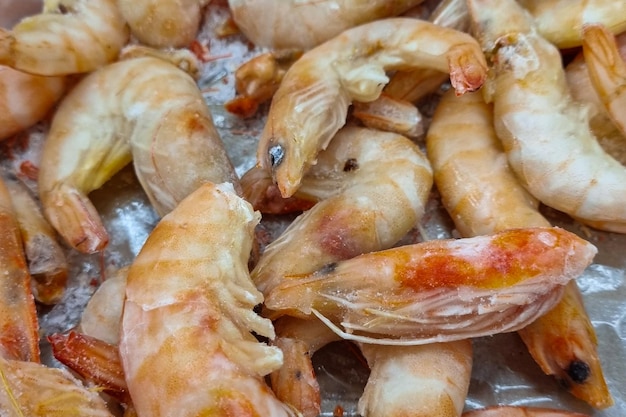 Frozen shrimp Seafood on the counter Fish market Closeup shooting of seafood