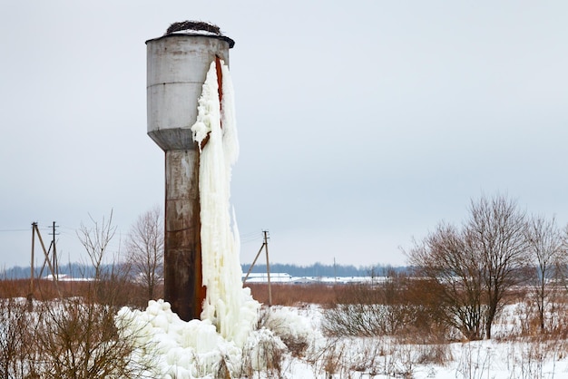 Frozen tank tower in country field