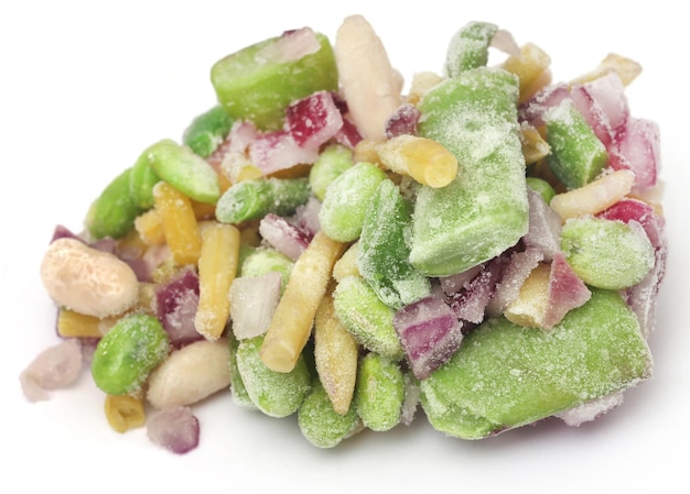 Frozen vegetables over white background