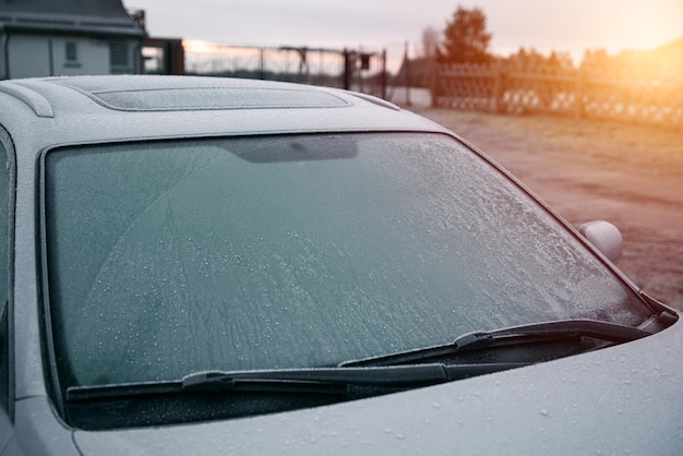 Frozen windshield wiper concept of dangerous driving during the winter season