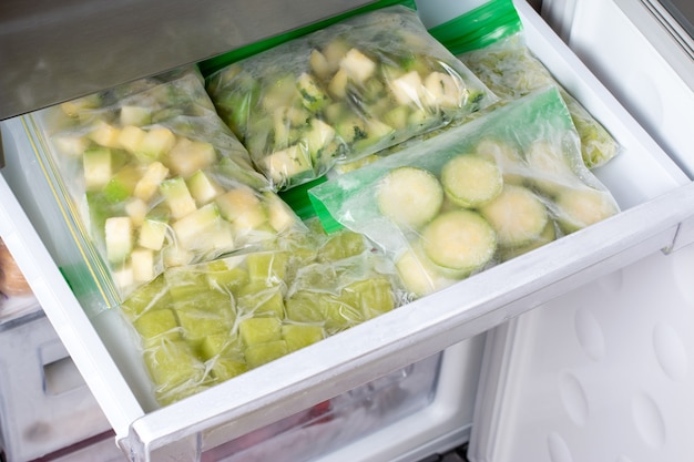 Frozen zucchini in the freezer. Frozen Food Concept. Horizontal